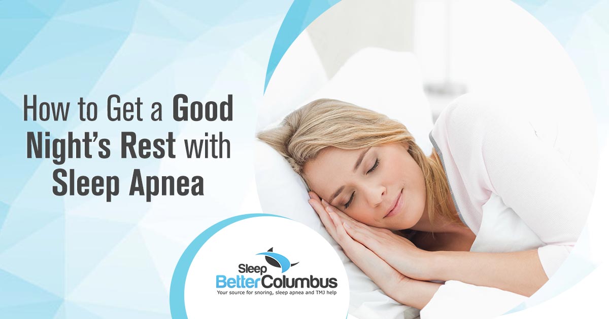 A sleeping woman smiling because she is able to sleep with sleep apnea